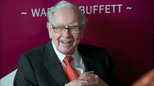 Warren Buffett said Berkshire Hathaway had $144 billion in cash and short-term investment but hopes that the era of hoarding cash would finally end.