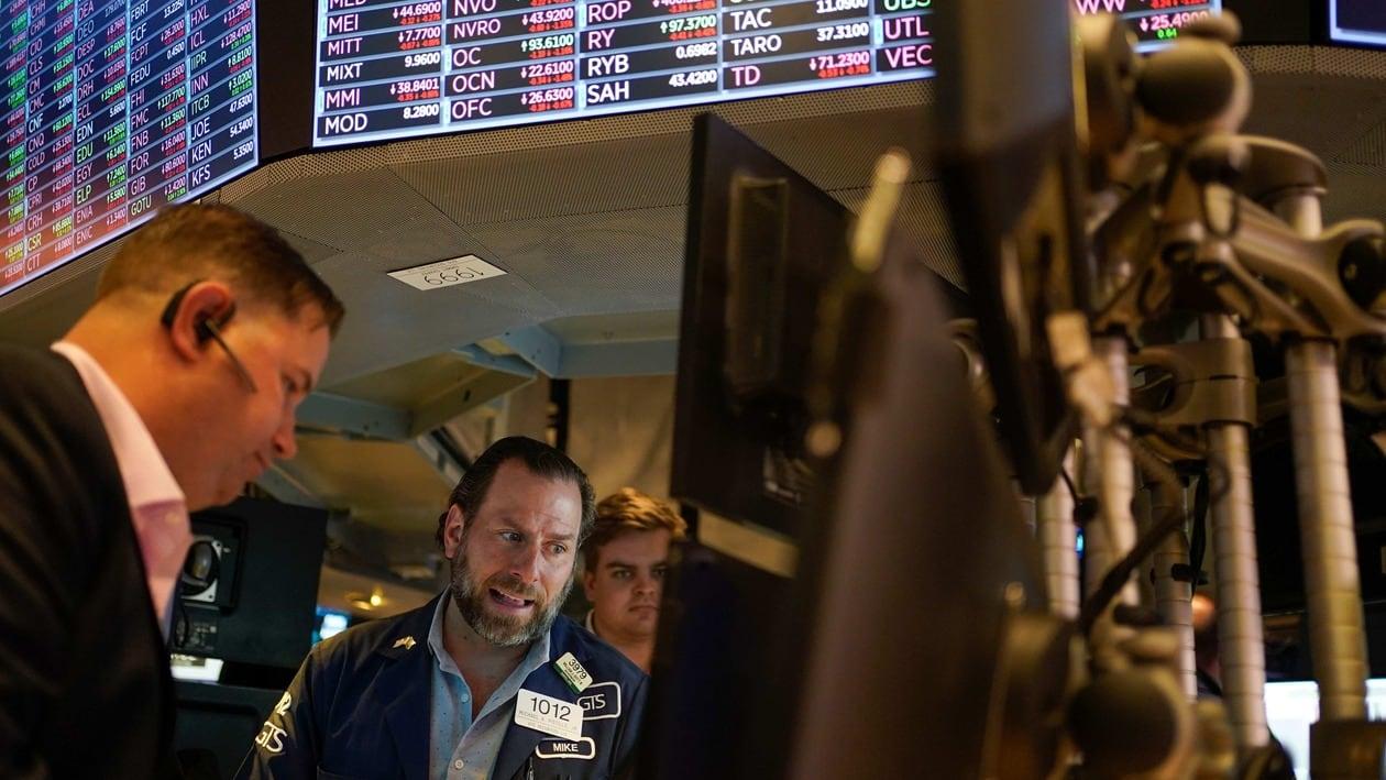 FILE - Traders work on the floor at the New York Stock Exchange in New York, May 19, 2022. Stocks are opening lower on Wall Street Tuesday, May 24, 2022 led by drops in tech heavyweights like the parent companies of Facebook and Google. The S&P 500 index fell 1.2% in the early going, and the tech-heavy Nasdaq was down almost twice as much, 2.3%. (AP Photo/Seth Wenig)
