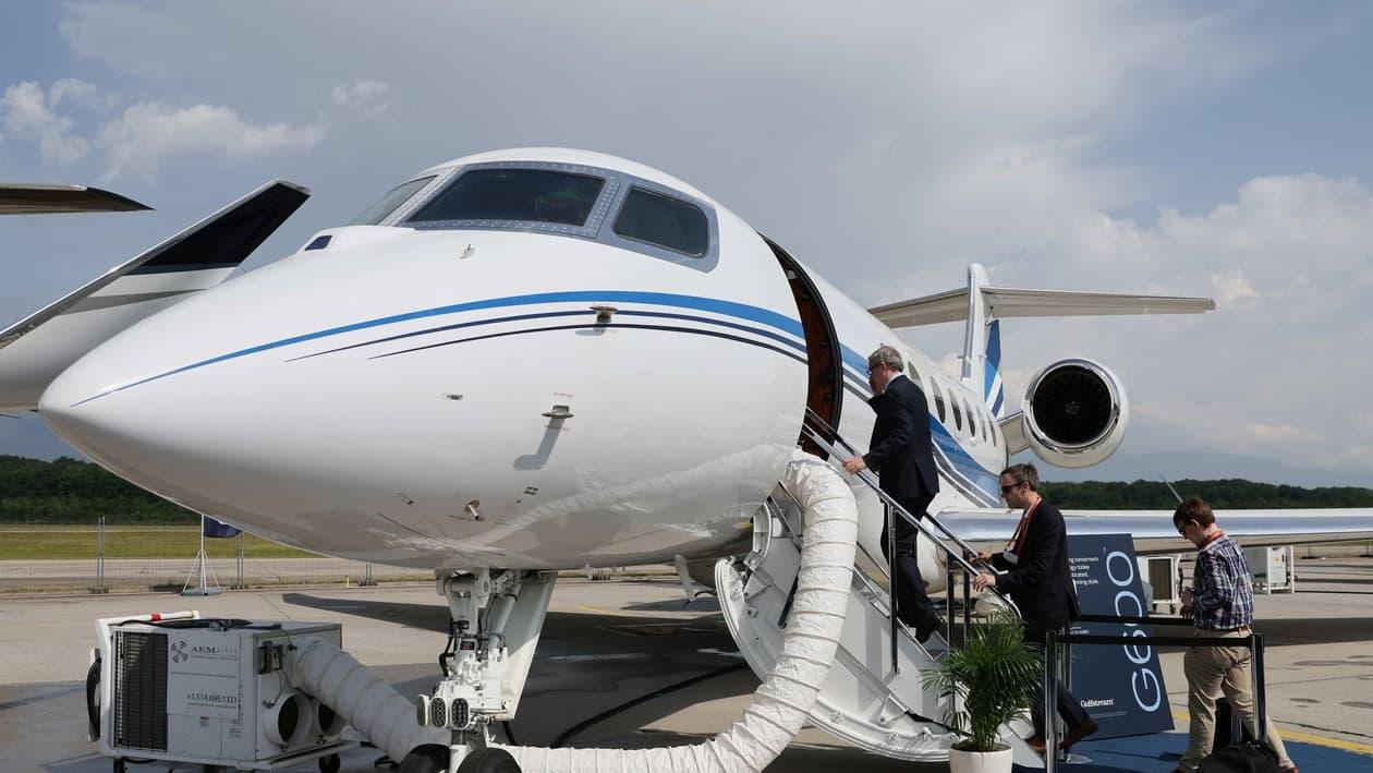 Visitors enter a Gulfstream G600 aircraft during the European Business Aviation Convention &amp; Exhibition (EBACE) in Geneva, Switzerland, May 23, 2022. REUTERS/Denis Balibouse