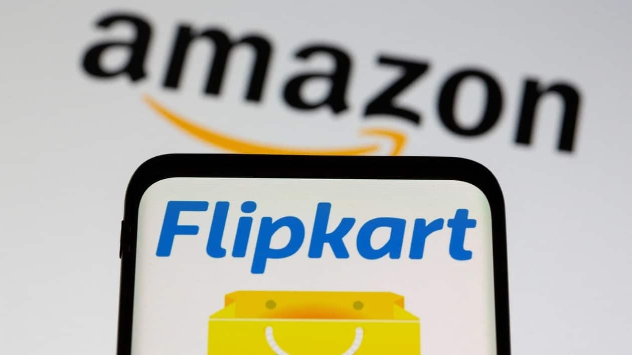 FILE PHOTO: Smartphone with Flipkart logo is seen in front of displayed Amazon logo in this illustration taken, July 30, 2021. REUTERS/Dado Ruvic/Illustration/File Photo