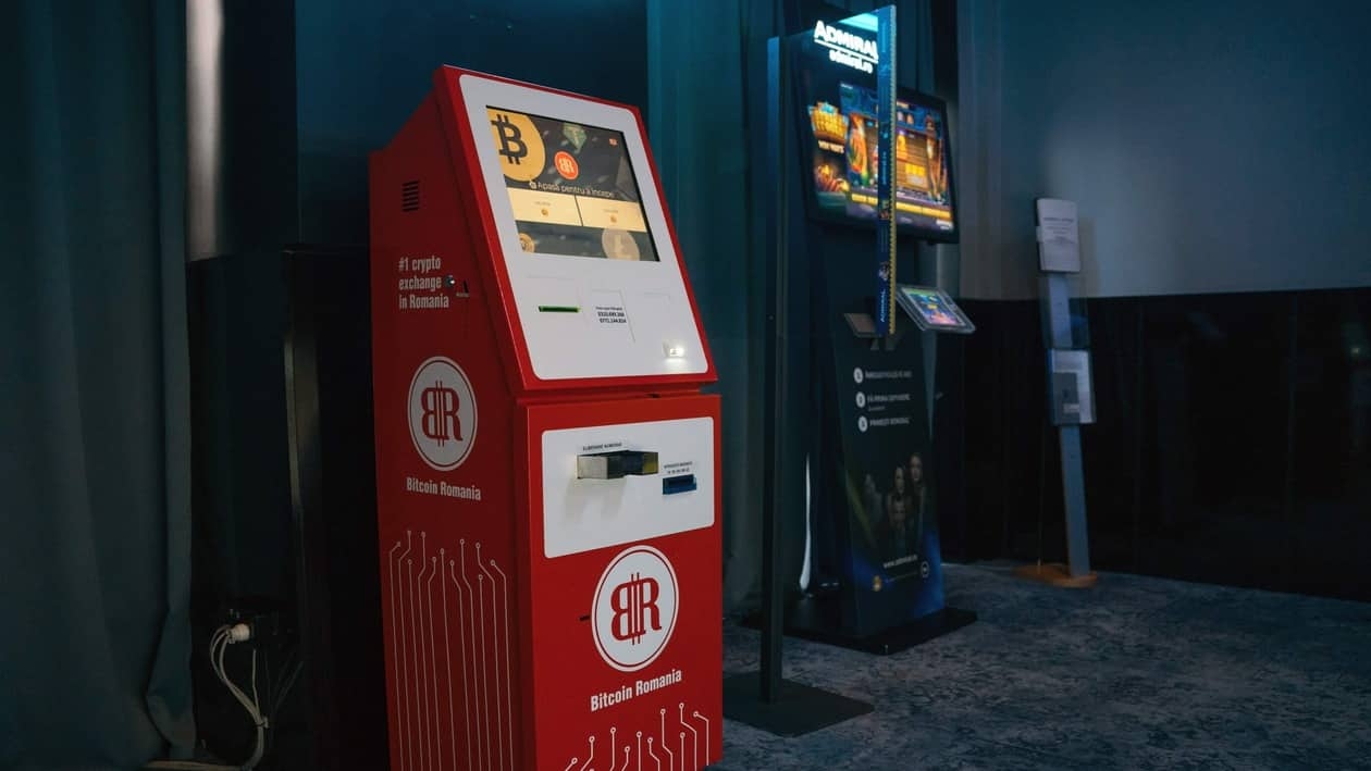 A cryptocurrency automated teller machine (ATM), operated by trading platform Biotcoin Romania, right, inside a room of slot machines at a casino in Bucharest, Romania, on Tuesday, May 31, 2022. Cryptocurrencies re-established their tendency to trade in tandem with equities after divergence last week sparked concerns that investors would continue dumping digital tokens even amid a revival in demand for other risk assets. Photographer: Andrei Pungovschi/Bloomberg