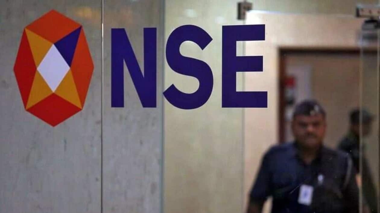 FILE PHOTO: A security guard walks past the logo of the National Stock Exchange (NSE) inside its building in Mumbai, India, May 28, 2019. REUTERS/Francis Mascarenhas