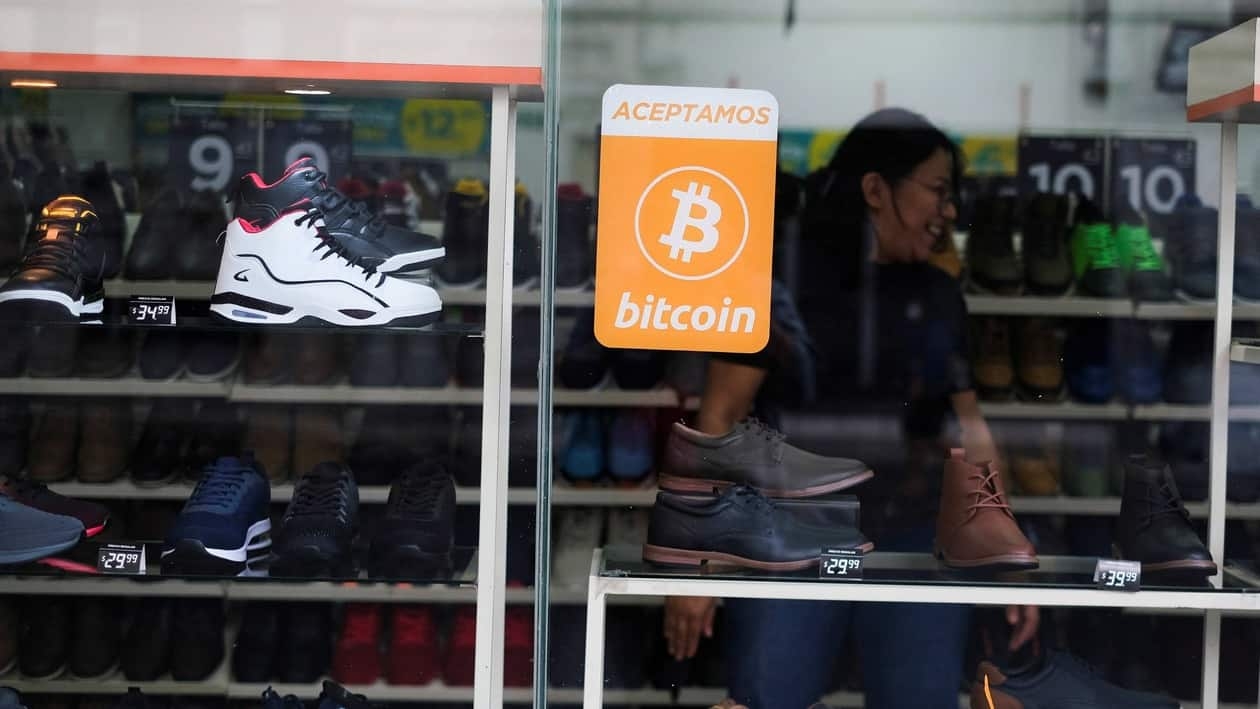 A Bitcoin sign is displayed outside a store where the cryptocurrency is accepted as a payment method in San Salvador, El Salvador, July 13, 2022. REUTERS/Jose Cabezas