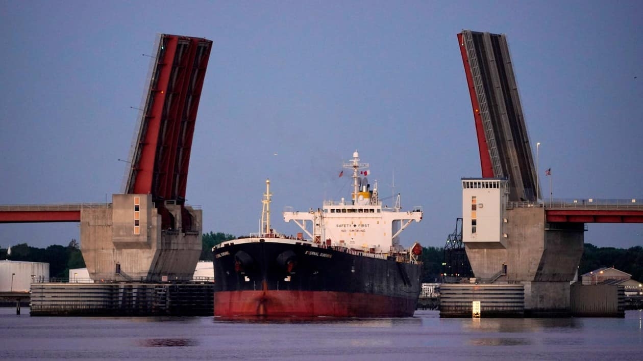 The oil tanker Eternal Sunshine travels through the drawbridge opening of the Casco Bay Bridge, Friday morning, June 10, 2022, in Portland, Maine. Crude oil that arrives by sea is pumped from Maine to Quebec, Canada, via the 236-mile Portland-Montreal Pipe Line. (AP Photo/Robert F. Bukaty)