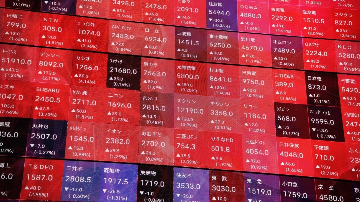 Stock figures on a rotating-cube screen in an atrium of the Kabuto One building, next the Tokyo Stock Exchange, in Tokyo, Japan, on Tuesday, June 7, 2022. Japan equities were mixed after the yen�slid�to a 20-year low versus the dollar as the gap between domestic and US yields widened.�Photographer: Akio Kon/Bloomberg