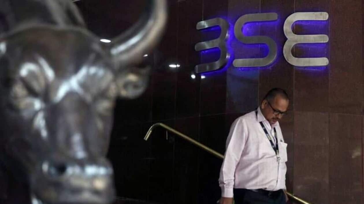 FILE PHOTO: A man walks out of the Bombay Stock Exchange (BSE) building in Mumbai, India, January 3 2020. REUTERS/Francis Mascarenhas