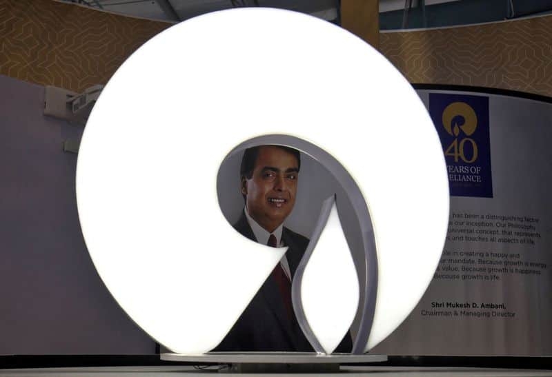 FILE PHOTO: The logo of Reliance Industries is pictured in a stall at the Vibrant Gujarat Global Trade Show at Gandhinagar, India, January 17, 2019. REUTERS/Amit Dave