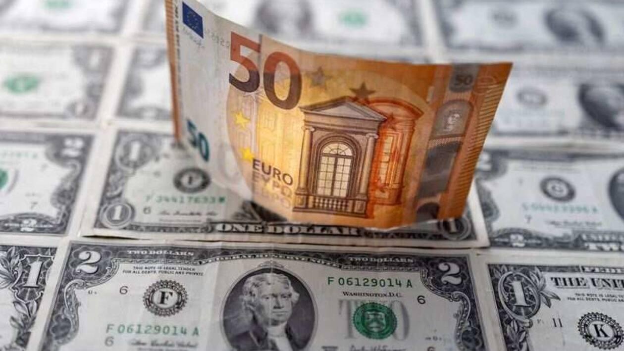 FILE PHOTO: A Euro banknote is displayed on U.S. Dollar banknotes in this illustration taken, February 14, 2022. REUTERS/Dado Ruvic/Illustration