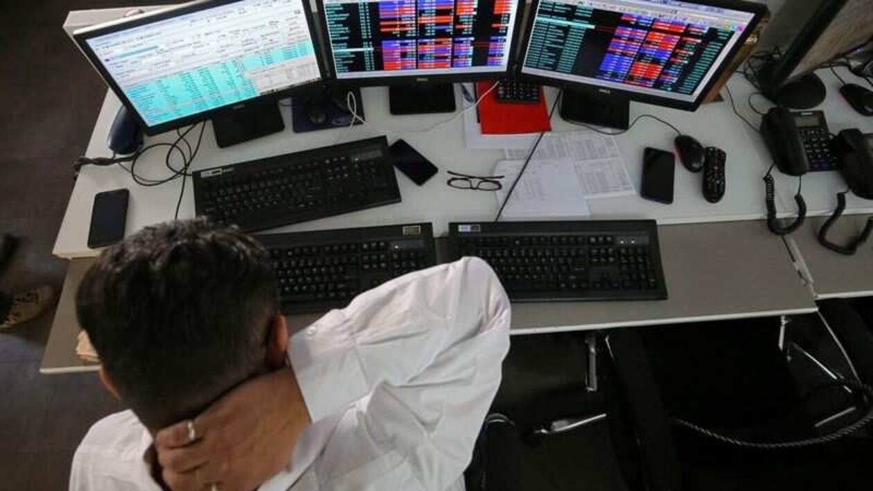 FILE PHOTO: A broker reacts while trading at his computer terminal at a stock brokerage firm in Mumbai, India, December 11, 2018. REUTERS/Francis Mascarenhas