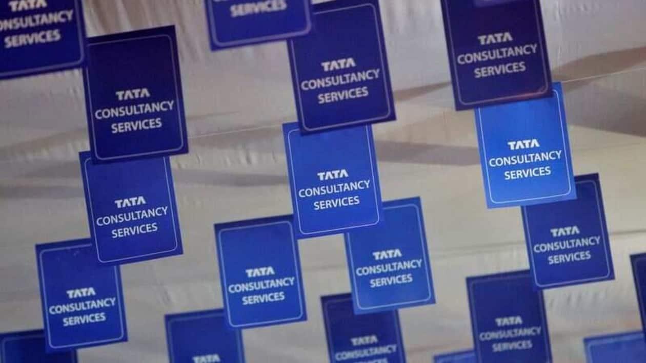FILE PHOTO: Logos of Tata Consultancy Services (TCS) are displayed at the venue of the annual general meeting of the software services provider in Mumbai, June 29, 2012. REUTERS/Vivek Prakash