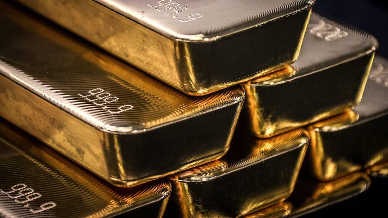 (FILES) This file photo taken on August 5, 2020 shows gold bullion bars after being inspected and polished at the ABC Refinery in Sydney. &nbsp;(Photo by DAVID GRAY / AFP)