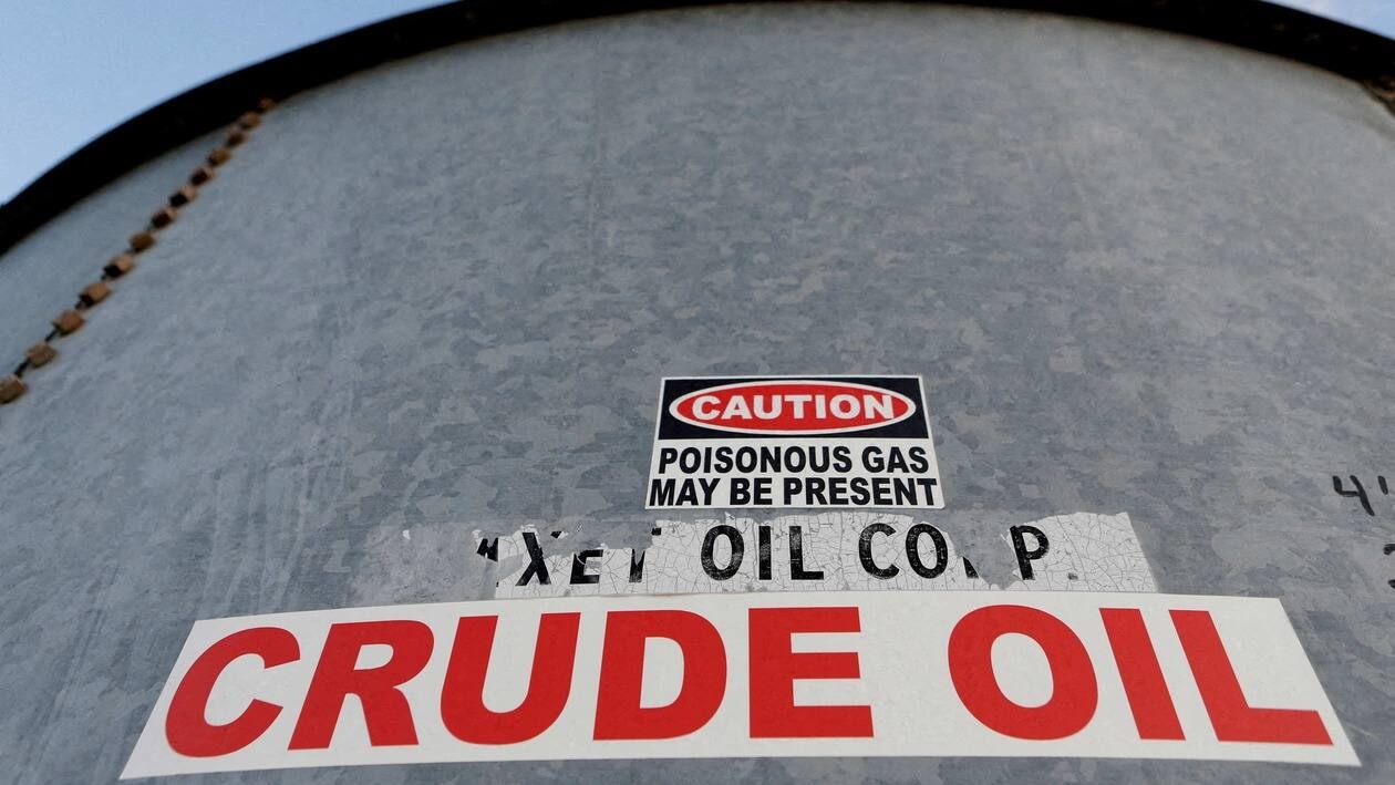FILE PHOTO: Sticker reads crude oil on the side of a storage tank in the Permian Basin in Mentone, Loving County, Texas, U.S. November 22, 2019.  REUTERS/Angus Mordant/File Photo