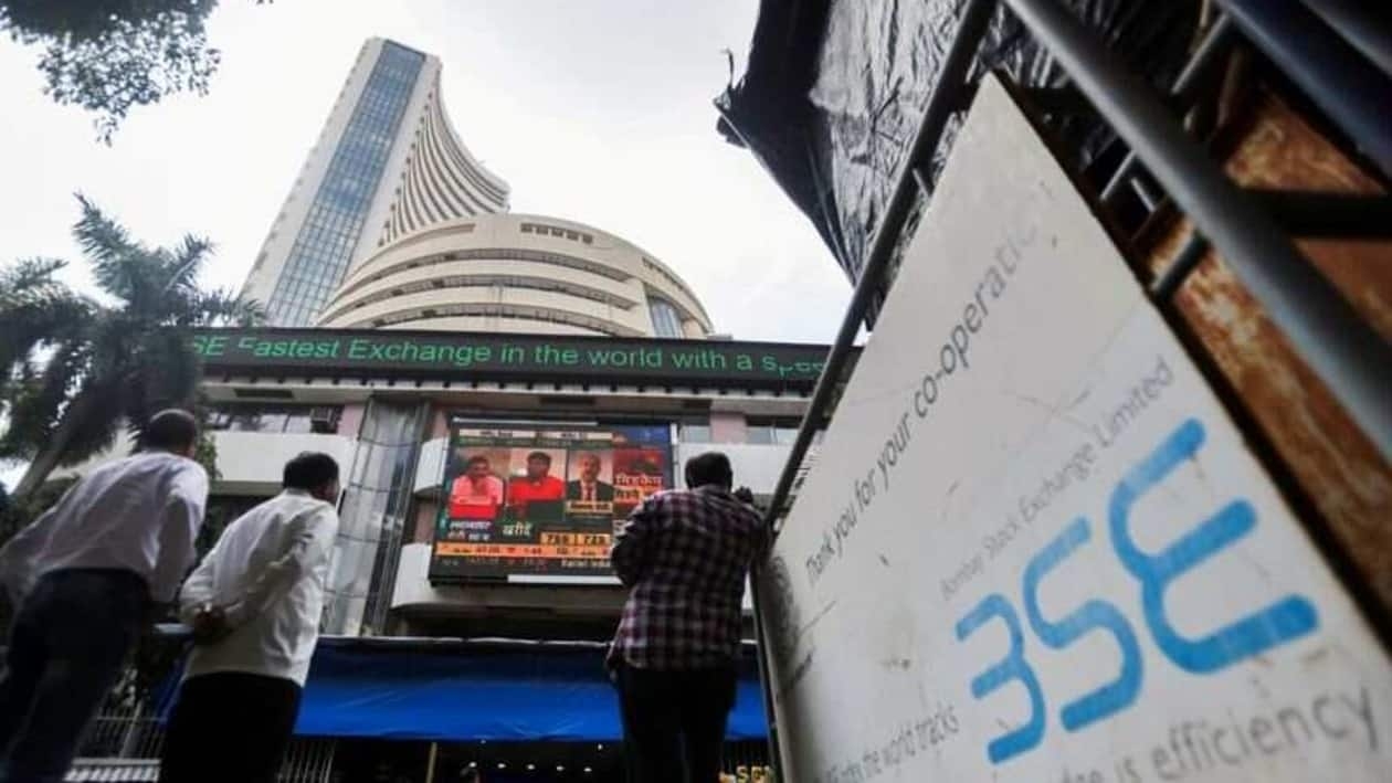 FILE PHOTO: In the past 1 month, the Nifty Midcap index has risen 7 percent as against a 4.5 percent rise in Nifty. Just in July, the midcap index has surged 9 percent versus a 5 percent rise in benchmarks. People stand outside the Bombay Stock Exchange (BSE), after Sensex surpassed the 60,000 level for the first time, in Mumbai, India, September 24, 2021. REUTERS/Francis Mascarenhas/File Photo