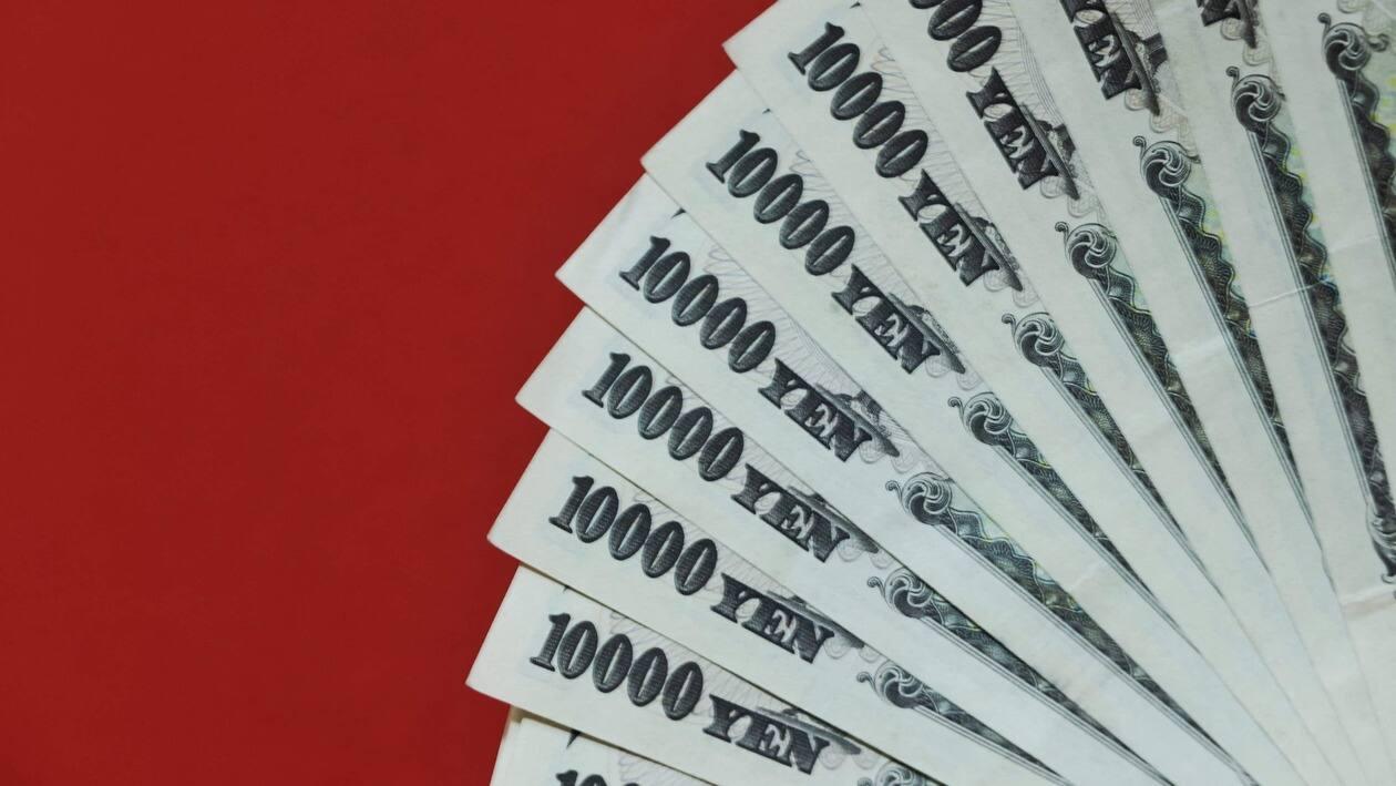 This photo illustration shows Japanese 10,000 yen banknotes (75 USD) in Tokyo on June 8, 2022. - The dollar fetched 133.03 yen in Asian trade on June 8, its highest in two decades. (Photo by Behrouz MEHRI / AFP)
