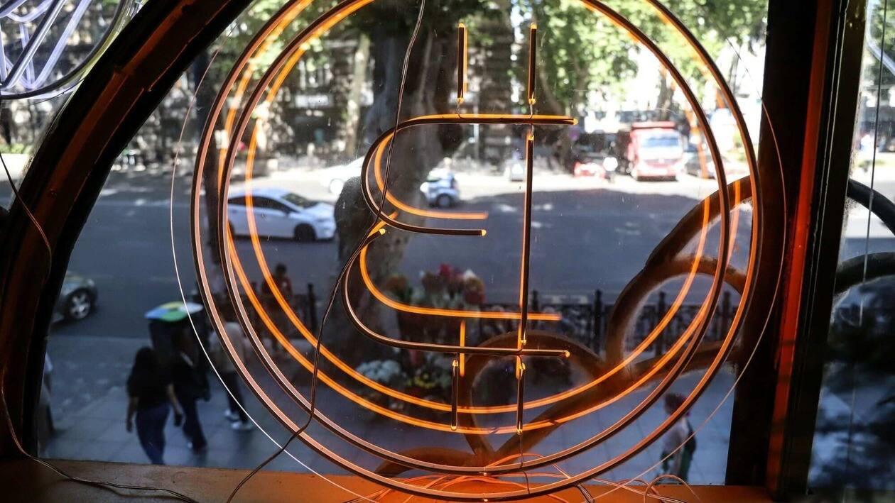 A bitcoin logo in the window of the Conexus Crypto currency exchange office in Tbilisi, Georgia, on Monday, July 25, 2022. A buzz is building in crypto-investor circles and on Twitter about�Bitcoin�s�stealth July rally, which has beleaguered investors starting to ponder whether the largest digital asset has found a bottom. Photographer: Valeria Mongelli/Bloomberg