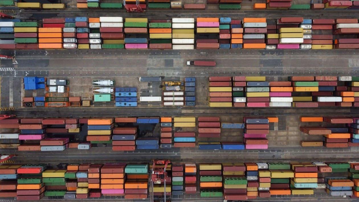 Containers are seen in the port of Buenos Aires on the Rio de la Plata river (River Plate), on August 3, 2022. - Economy 'super minister' Sergio Massa, who was appointed to oversee the economy, development and agriculture ministries as well as relations with international organizations, will be sworn-in on August 3.
The South American country has suffered years of economic crisis, with some 37 percent of its population now living in poverty. Inflation for the first half of this year alone topped 36 percent, and is predicted to reach 80 percent by the year's end. (Photo by Luis ROBAYO / AFP)