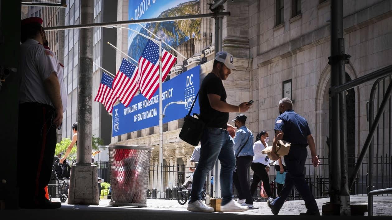 Pedestrians walk past the New York Stock Exchange, Thursday, July 7, 2022 in New York. Stocks rallied again on Wall Street Thursday, and the S&P 500 is closing out a fourth straight gain. (AP Photo/J. David Ake)