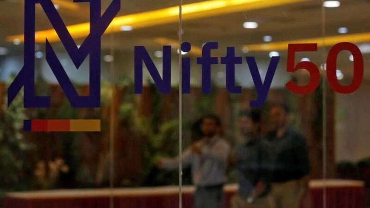 FILE PHOTO: People walk past a new brand identity for Nifty Indices inside the National Stock Exchange (NSE) building in Mumbai, India, May 28, 2019. REUTERS/Francis Mascarenhas