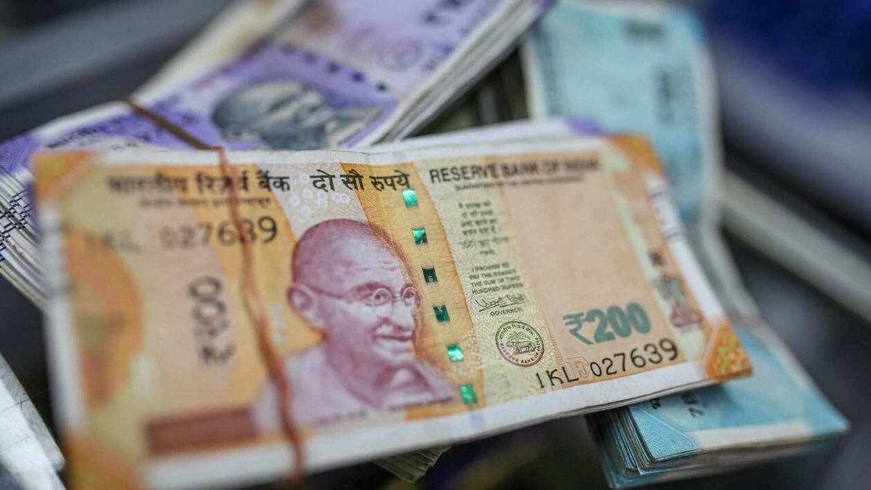 Indian rupee banknotes arranged for a photograph at a general store in Mumbai, India, on Wednesday, July 20, 2022. The rupee slid to all-time low of 80.06 per dollar on Tuesday, and has lost 2.4% over the past month, the third-worst performing Asian currency over the period. Photographer: Dhiraj Singh/Bloomberg