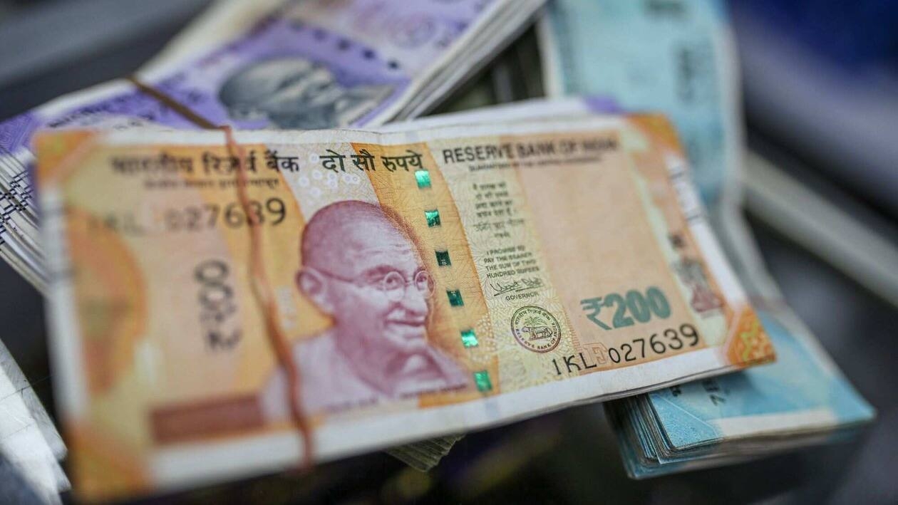 Indian rupee banknotes arranged for a photograph at a general store in Mumbai, India, on Wednesday, July 20, 2022. The rupee slid to all-time low of 80.06 per dollar on Tuesday, and has lost 2.4% over the past month, the third-worst performing Asian currency over the period. Photographer: Dhiraj Singh/Bloomberg