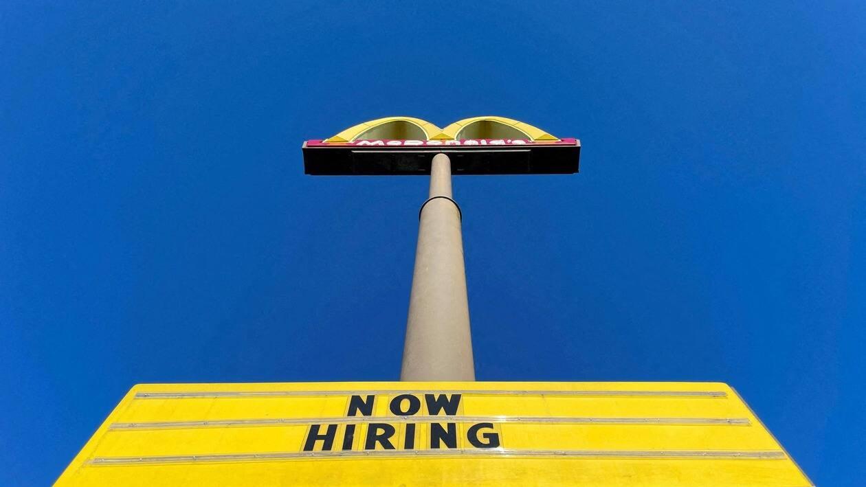 FILE PHOTO: A sign outside a McDonalds restaurant reads Now Hiring in Augusta, Georgia, U.S., April 11, 2022. REUTERS/Brian Snyder/File Photo