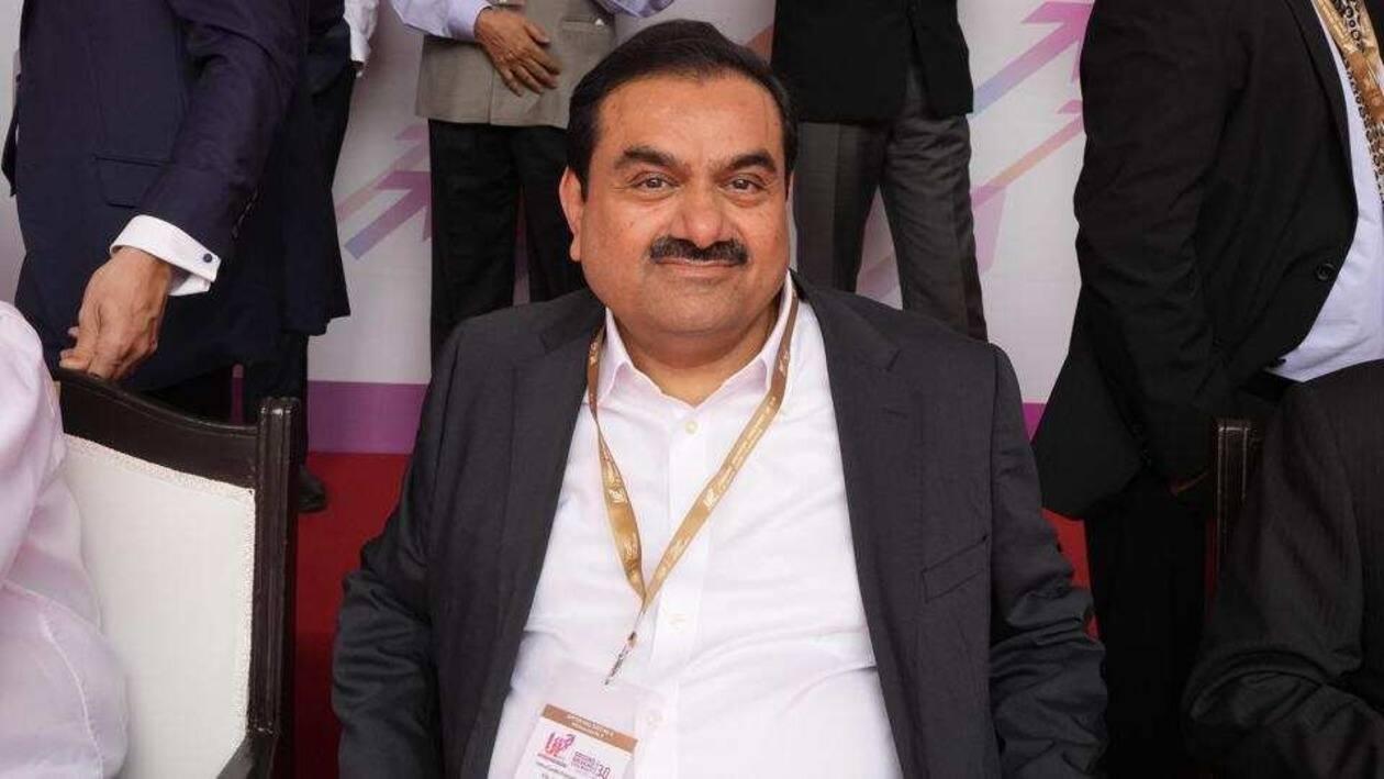 Industrialist Gautam Adani, center, sits for a group photograph during the Ground Breaking Ceremony @3.0 of the UP Investors Summit Lucknow in the northern Indian state of Uttar Pradesh, India, Friday, June 3, 2022. (AP Photo/Rajesh Kumar Singh) (AP)