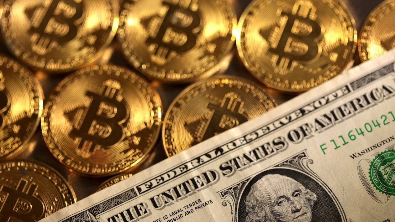 FILE PHOTO: Representations of cryptocurrency Bitcoin and U.S. dollar are seen in this illustration.