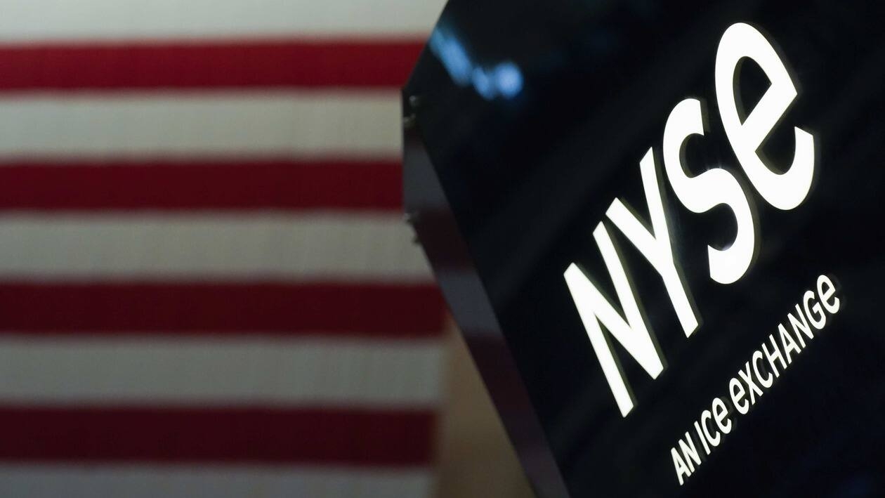 FILE - An NYSE sign is seen on the floor at the New York Stock Exchange in New York, on June 15, 2022. Stocks are opening lower on Wall Street on Tuesday, Aug. 9, 2022, led by a steep drop for Norwegian Cruise Line. The S&P 500 is off 0.2% just after the opening bell Tuesday and the Nasdaq and Dow Jones Industrial Average are also falling. (AP Photo/Seth Wenig, File)