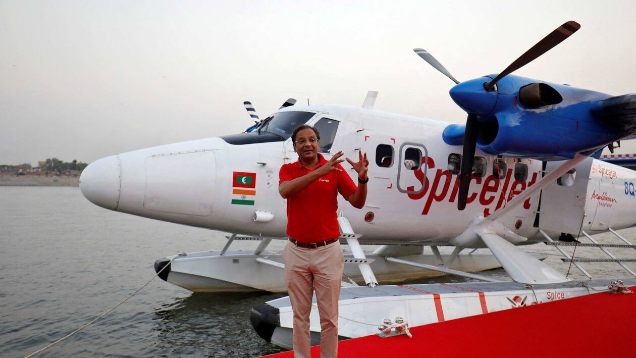 FILE PHOTO: Ajay Singh, Chairman and Managing Director of Indian budget airline SpiceJet, speaks with the media next to a seaplane operated by SpiceJet's Spice Shuttle, in Ahmedabad, India, October 31, 2020. REUTERS/Amit Dave/File Photo