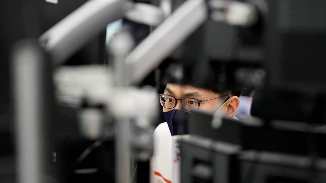 A currency trader watches computer monitors at a foreign exchange dealing room in Seoul, South Korea, Monday, Sept. 5, 2022. Asian stock markets declined Monday after Wall Street ended last week lower and China tightened anti-virus controls. (AP Photo/Lee Jin-man)