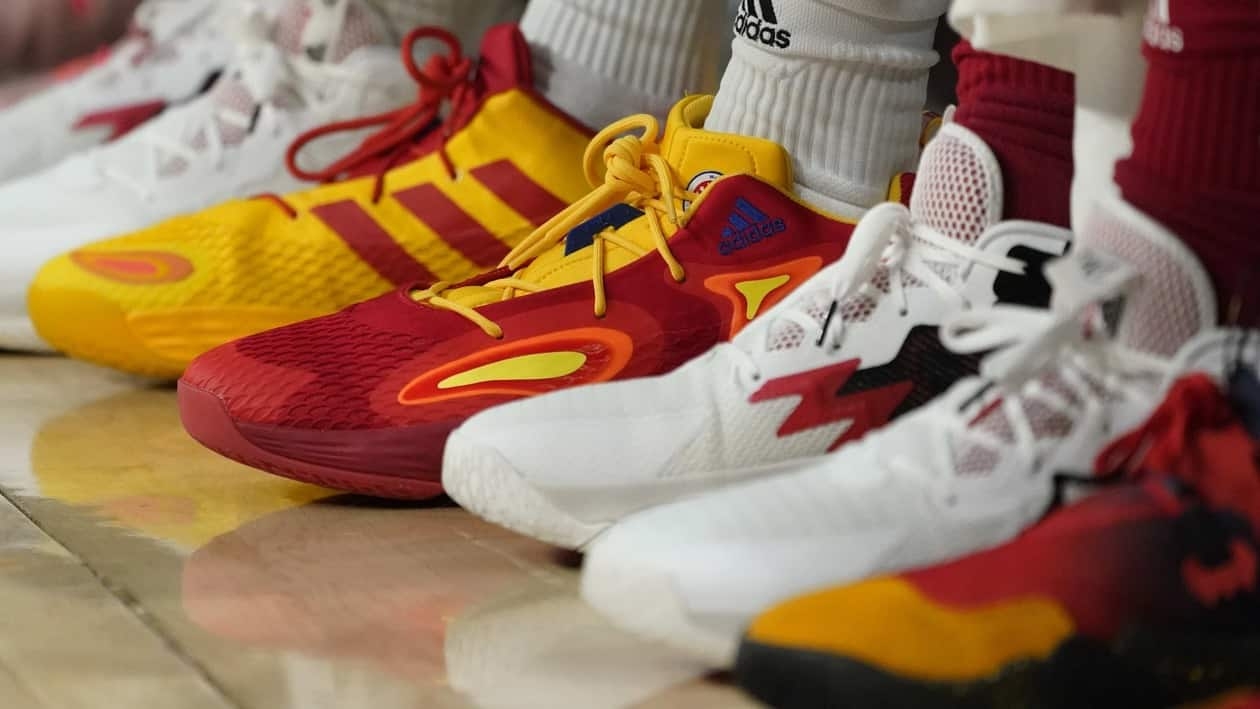 FILE - Basketball sneakers are seen at a game, Tuesday, March 29, 2022, in Chicago. Buy now, pay later loans allow users to pay for items such as new sneakers, electronics or luxury goods in installments. (AP Photo/Charles Rex Arbogast, File)