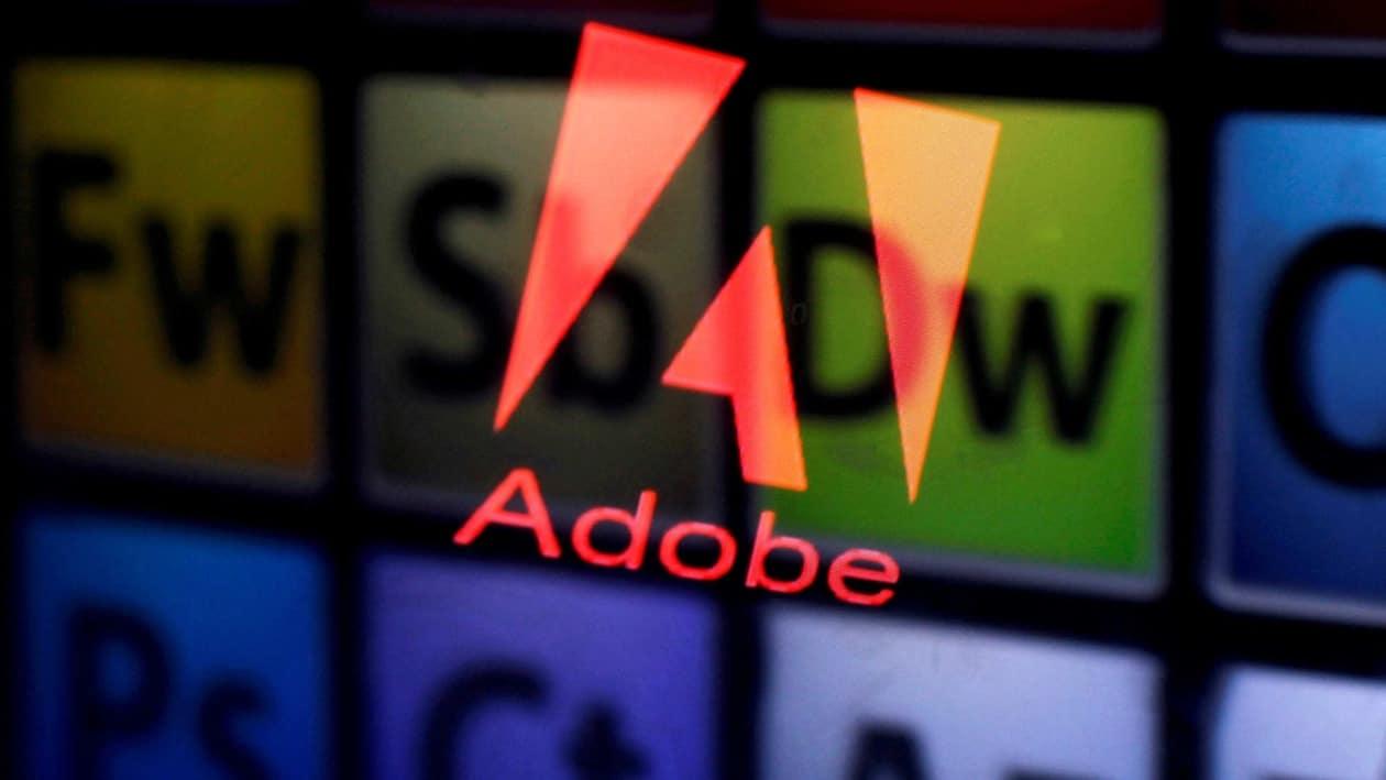 FILE PHOTO: FILE PHOTO: An Adobe logo and Adobe products are seen reflected on a monitor display and an iPad screen, in this picture illustration July 8, 2013.     REUTERS/Dado Ruvic/Illustration/File Photo             GLOBAL BUSINESS WEEK AHEAD PACKAGE Ð SEARCH BUSINESS WEEK AHEAD MARCH 13 FOR ALL IMAGES/File Photo