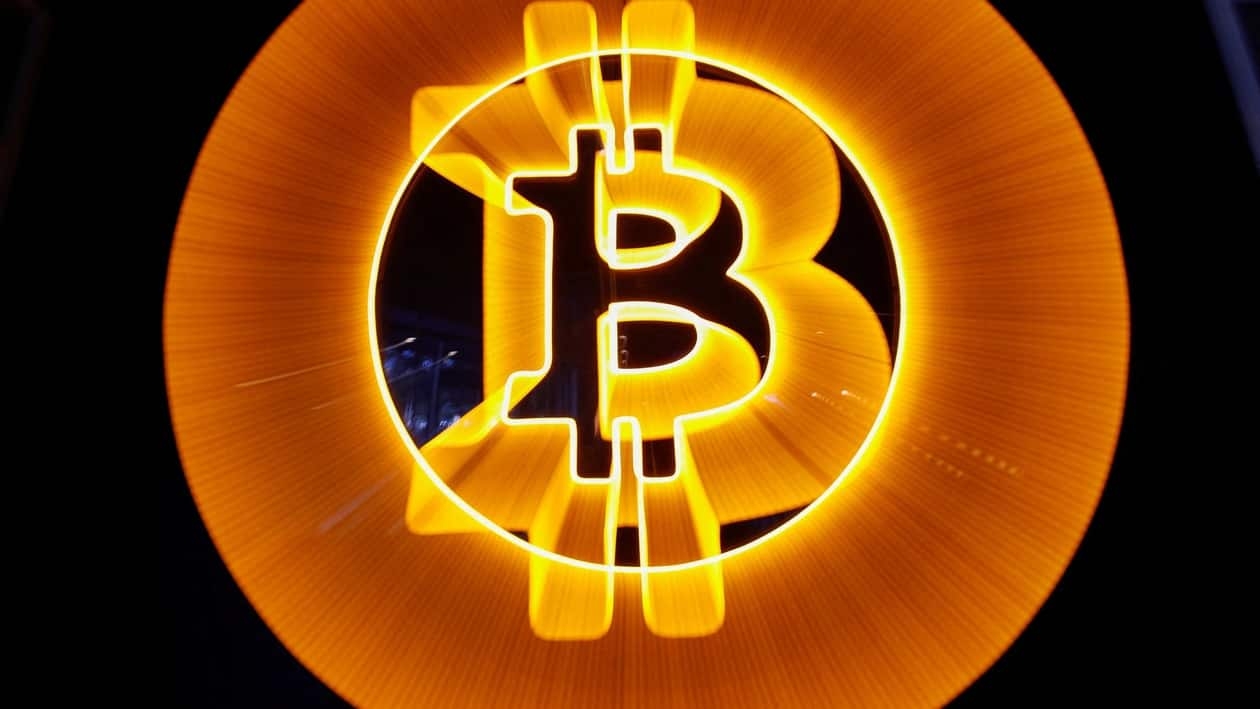 FILE PHOTO: A neon logo of cryptocurrency Bitcoin is seen at the Crypstation cafe, in downtown Buenos Aires, Argentina, May 5, 2022. REUTERS/Agustin Marcarian/File Photo