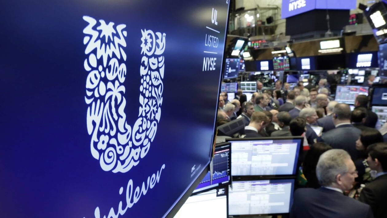 FILE - In this Thursday, March 15, 2018 file photo, the logo for Unilever appears above a trading post on the floor of the New York Stock Exchange. Unilever says it raised prices by more than 11% between April and June as inflation surged. The consumer goods giant said Tuesday, July 26, 2022,  that underlying sales growth of 8.1% in the first half of the year was driven by rising prices to offset the higher costs it paid to create everything from Ben & Jerry’s ice cream to Dove skin care. It brought in revenue of $30 billion in the first half of 2022.  .(AP Photo/Richard Drew, File)