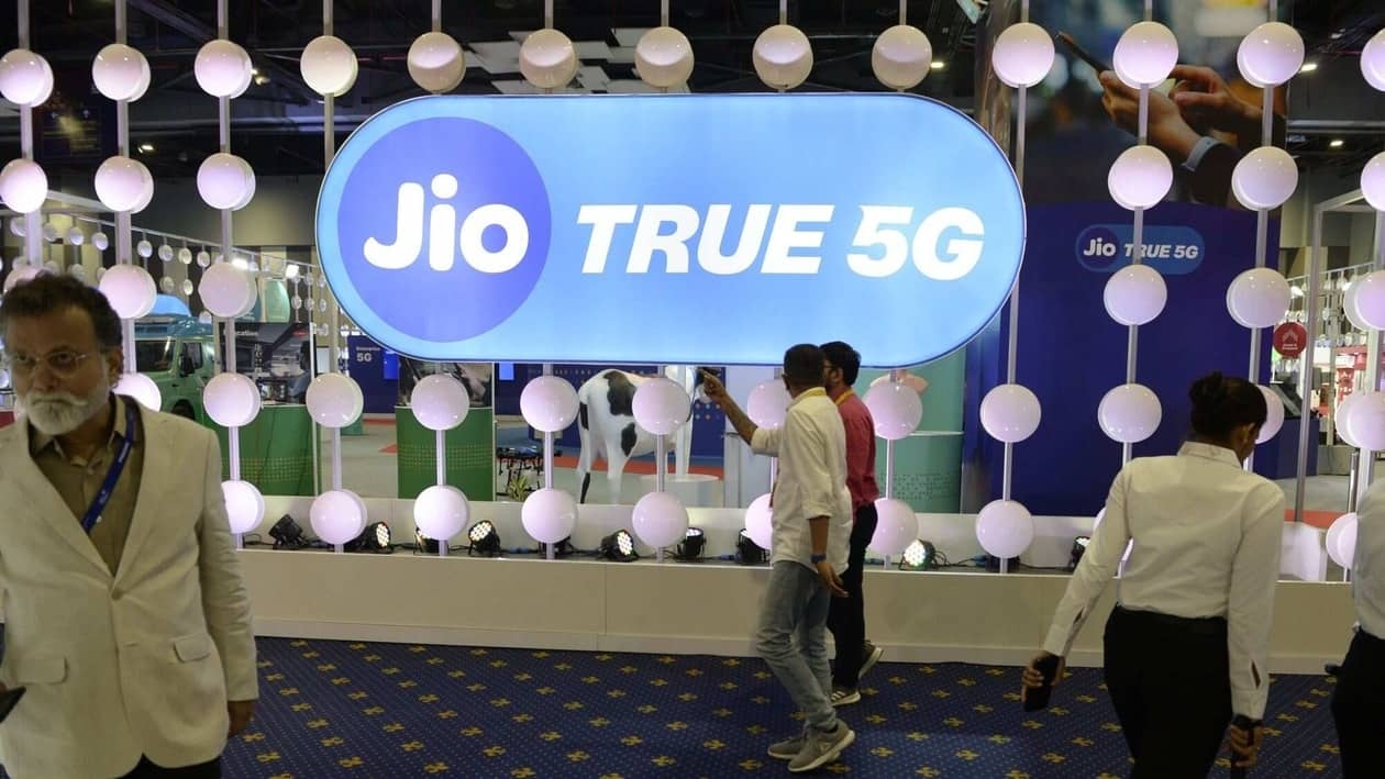 Visitors at the Reliance Jio Infocomm Ltd. booth at India Mobile Congress 2022 exhibition in New Delhi, India, on Saturday, Oct. 1, 2022. Narendra Modi, India's prime minister, announced the launch of 5G services in India during the event on Oct. 1. Photographer: Prakash Singh/Bloomberg