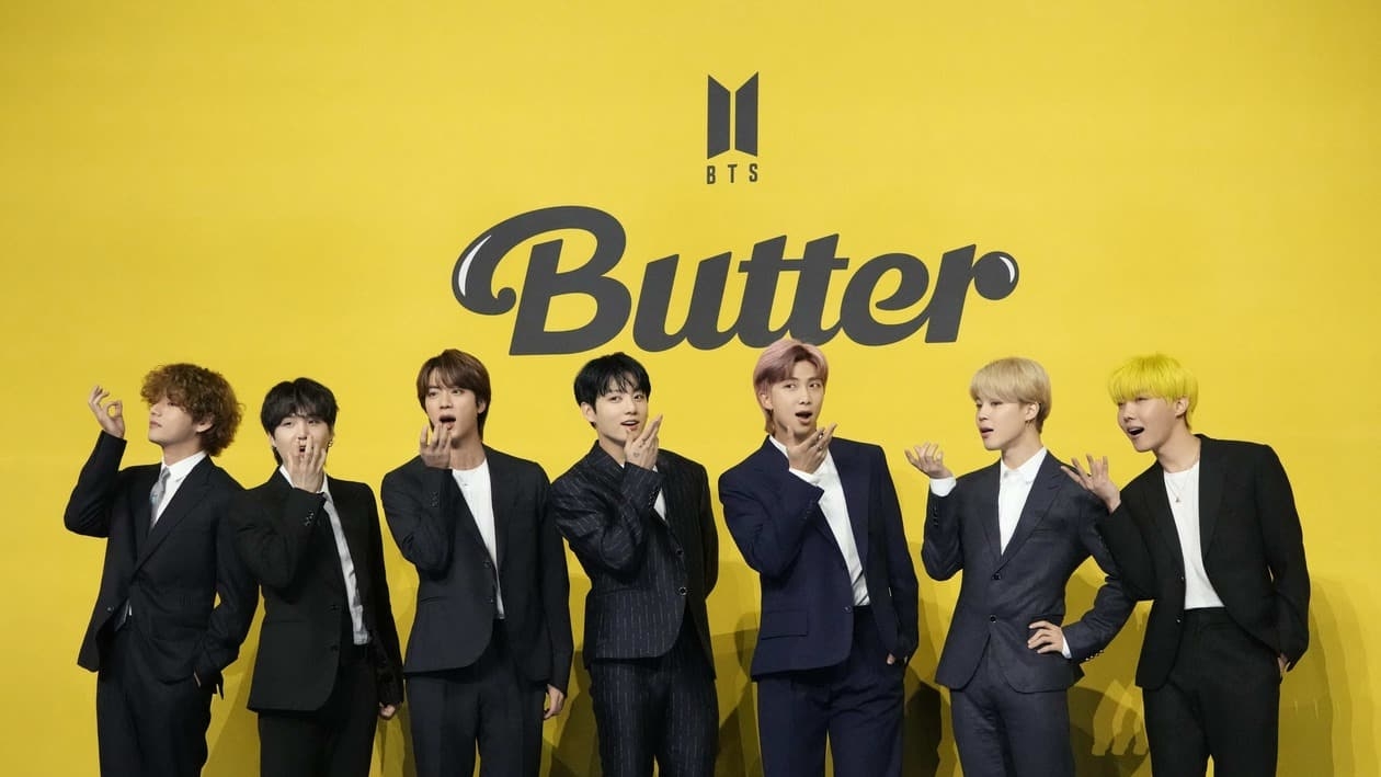 FILE- Members of South Korean K-pop band BTS, V, SUGA, JIN, Jung Kook, RM, Jimin, and j-hope from left to right, pose for photographers ahead of a press conference to introduce their new single Butter in Seoul, South Korea, May 21, 2021. The members of K-pop band BTS will serve their mandatory military duties under South Korean law, their management company said Monday, Oct. 17, 2022, effectively ending a debate on exempting them because of their artistic accomplishments. (AP Photo/Lee Jin-man, File)