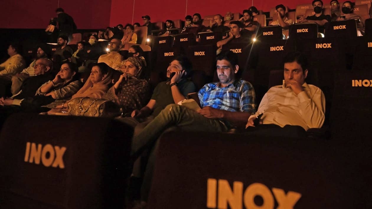 Srinagar, Oct 01 (ANI): People watch the screening of Hrithik Roshan and Saif Ali Khan starrer Vikram Vedha as the cinema hall reopens for public, at INOX multiplex theatre, in Srinagar on Saturday. (ANI Photo)