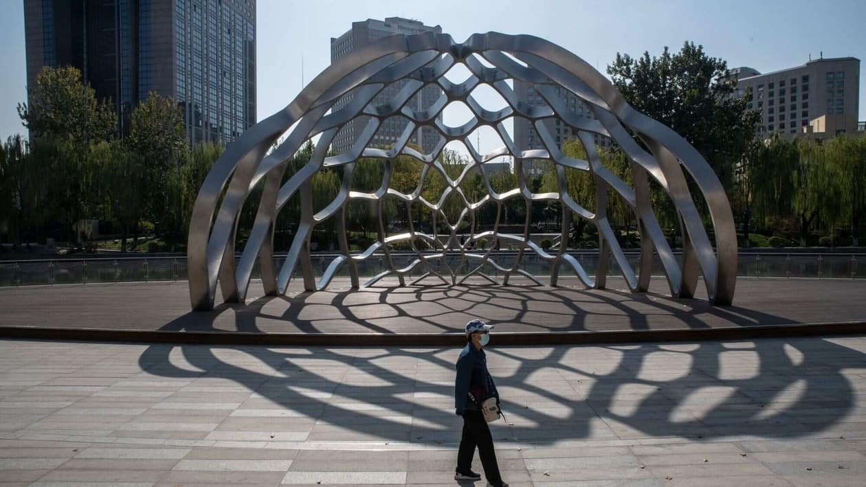 A pedestrian at a park in Beijing, China, on Monday, Oct. 24, 2022. China's yuan weakened and the country�s stocks tumbled in Hong Kong to the lowest level since the depths of the 2008 global financial crisis, a stark rebuke of President Xi Jinping's move to stack his leadership ranks with loyalists. Source: Bloomberg