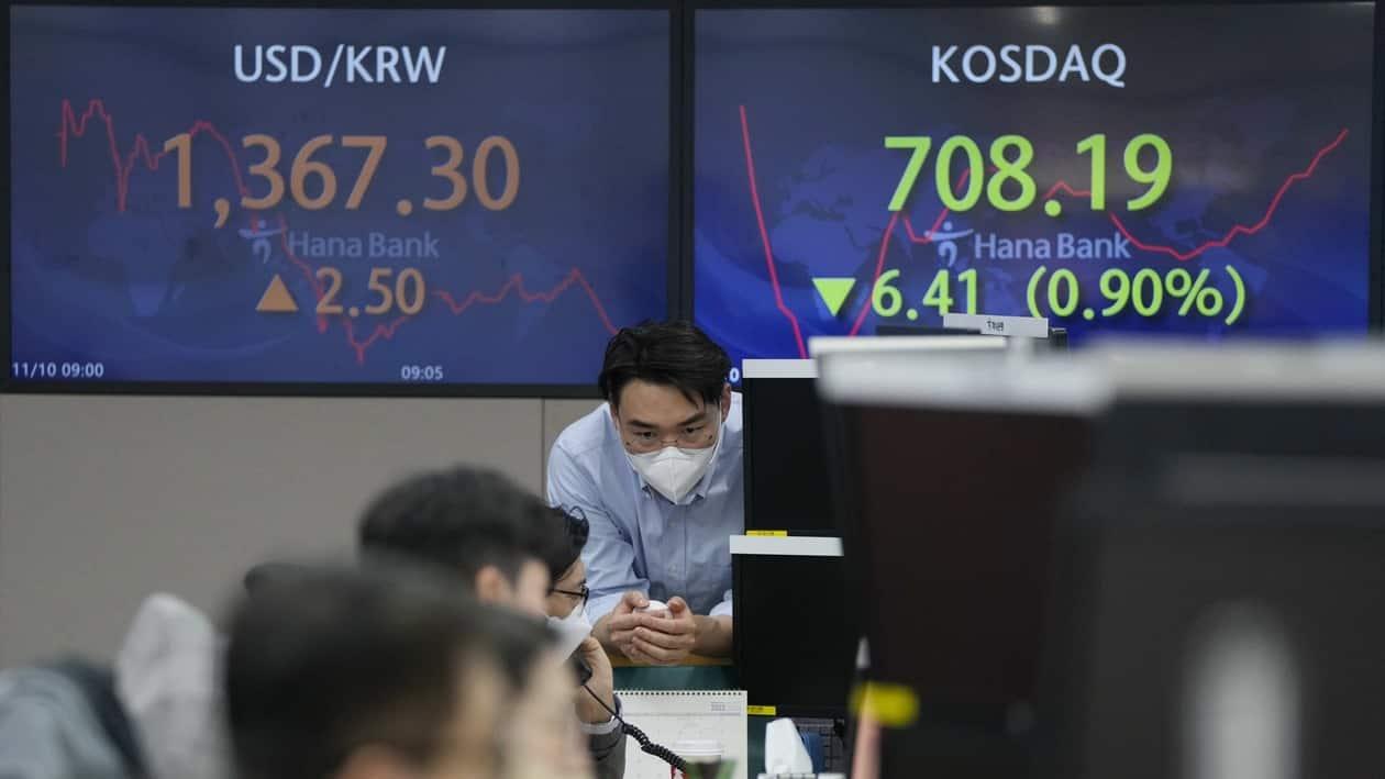 Currency traders work at the foreign exchange dealing room of the KEB Hana Bank headquarters in Seoul, South Korea, Thursday, Nov. 10, 2022. Asian stock markets followed Wall Street lower on Thursday ahead of a U.S. inflation update that will likely influence Federal Reserve plans for more interest rate hikes after elections left control of Congress uncertain.(AP Photo/Ahn Young-joon)