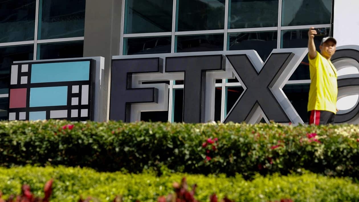 FILE PHOTO: The logo of FTX is seen at the entrance of the FTX Arena in Miami, Florida, U.S., November 12, 2022. REUTERS/Marco Bello/File Photo