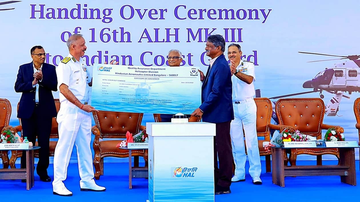 Bengaluru, Nov 15 (ANI) Hindustan Aeronautics Limited's (HAL) CMD C B Ananthakrishnan hands a certificate of conformity to Indian Coast Guard Director General V S Pathania at handing over ceremony of the 16th ALHs (Mk-III, Maritime role), in Bengaluru on Tuesday. (ANI Photo)