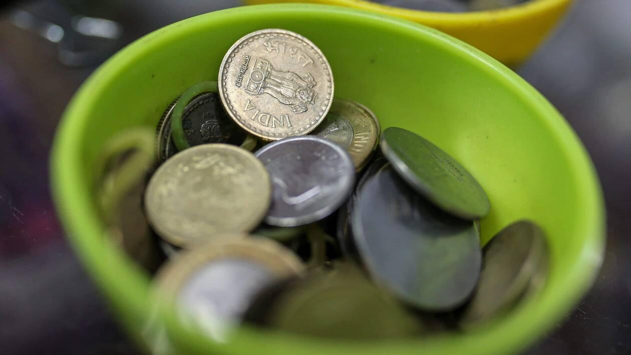 Indian rupee coins in a bowl arranged for a photograph at a general store in Mumbai, India, on Wednesday, July 20, 2022. The rupee slid to all-time low of 80.06 per dollar on Tuesday, and has lost 2.4% over the past month, the third-worst performing Asian currency over the period. Photographer: Dhiraj Singh/Bloomberg