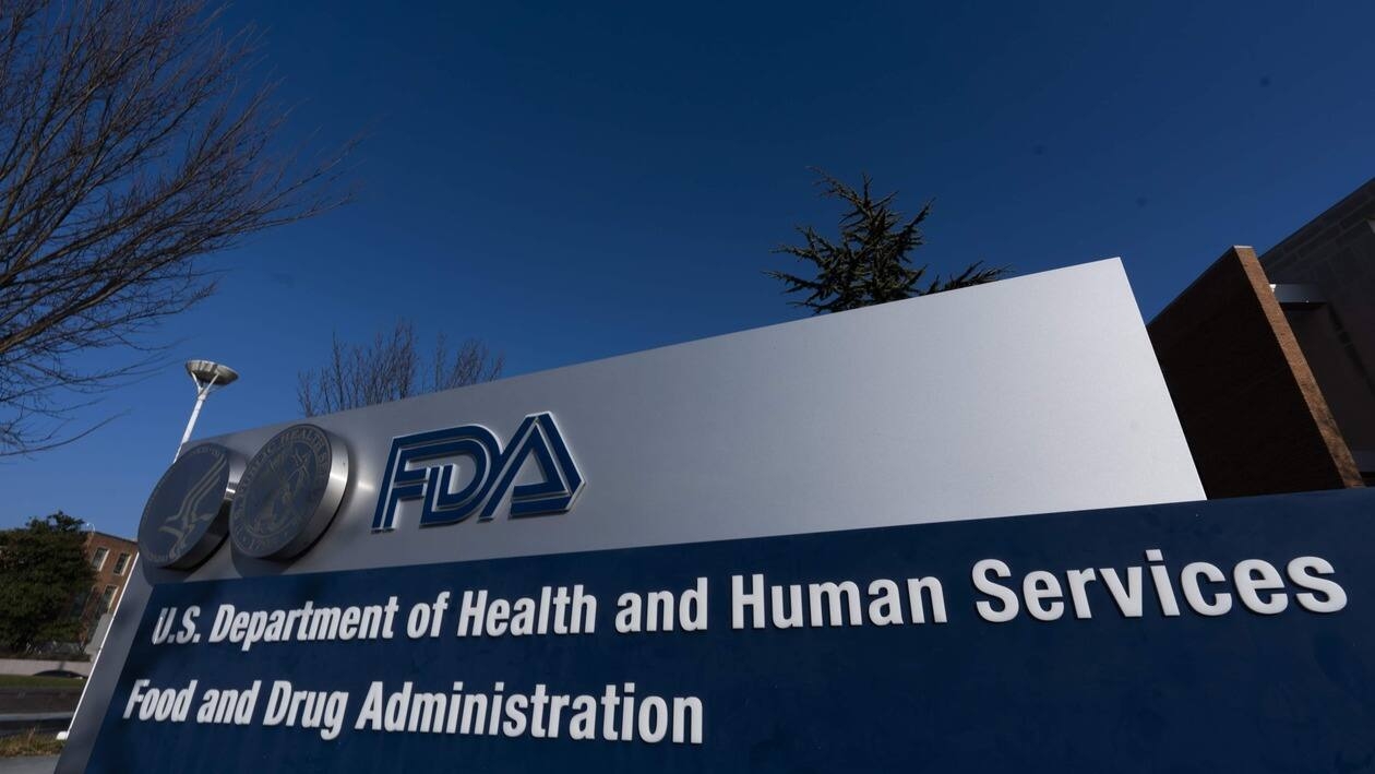 FILE - A sign in front of the Food and Drug Administration building is seen on Dec. 10, 2020, in Silver Spring, Md. Expedited drug approvals slowed in 2022, as the FDA's controversial accelerated pathway came under new scrutiny from Congress, government watchdogs and some of the agency’s own leaders. With less than a month remaining in the year, the agency’s drug center has granted 10 accelerated approvals — fewer than the tally in each of the last five years, when use of the program reached all-time highs. (AP Photo/Manuel Balce Ceneta, File)