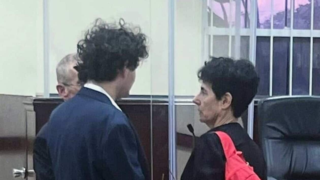 (EDITORS NOTE: Best quality available) Sam Bankman-Fried, founder of FTX, left, and his mother Barbara Fried at the Magistrate's Court in Nassau, Bahamas, on Tuesday, Dec. 13, 2022. Bankman-Fried�was denied bail by a judge, leaving the disgraced co-founder of crypto giant FTX behind bars. Photographer: Katanga Johnson/Bloomberg