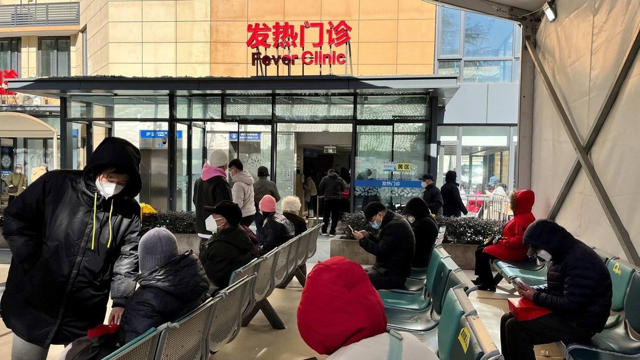 FILE PHOTO: People wait outside a fever clinic at a hospital as coronavirus disease (COVID-19) outbreak continues, in Shanghai, China December 24, 2022. REUTERS/Staff/File Photo