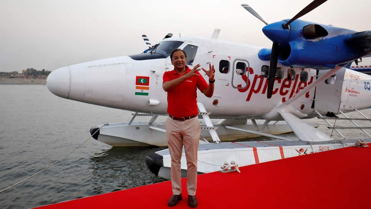 FILE PHOTO: Ajay Singh, Chairman and Managing Director of Indian budget airline SpiceJet, speaks with the media next to a seaplane operated by SpiceJet's Spice Shuttle, in Ahmedabad, India, October 31, 2020. REUTERS/Amit Dave/File Photo