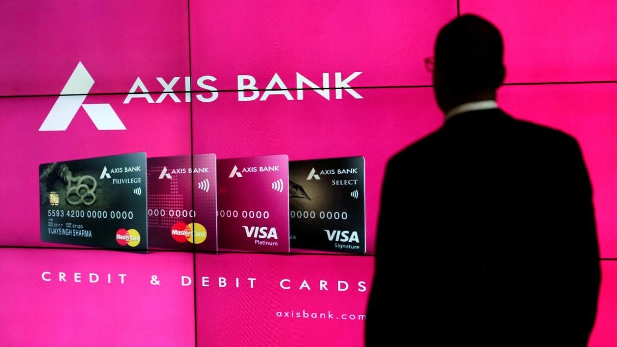 FILE PHOTO: A visitor watches an Axis Bank's advertisement at its corporate headquarters in Mumbai, India July 25, 2017. REUTERS/Danish Siddiqui/File Photo