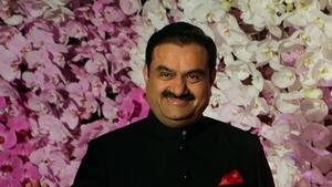 FILE- Adani Group Gautam Chairman Gautam Adani poses during Akash Ambani's wedding reception in Mumbai, India, March 10, 2019. Asia’s richest man, Gautam Adani, made his vast fortune betting on coal as an energy hungry India grew swiftly after liberalizing its economy in the 1990s. He's now set his sights on becoming world's biggest renewable energy player, by 2030, adroitly aligning his investments with the government’s own priorities. (AP Photo/Rajanish Kakade, File)