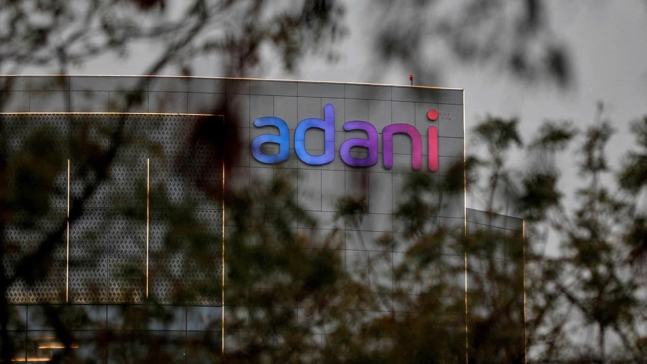 FILE PHOTO: The logo of the Adani Group is seen on the facade of its Corporate House on the outskirts of Ahmedabad, India, January 27, 2023. REUTERS/Amit Dave/File Photo