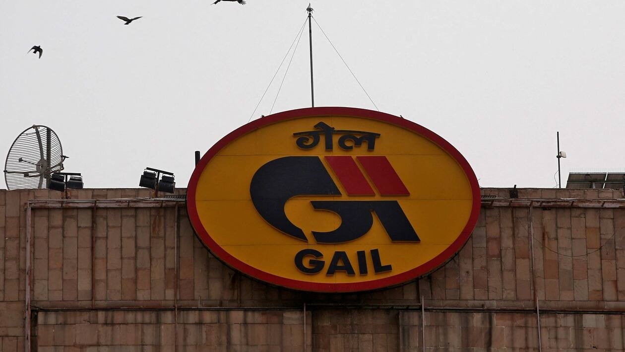 FILE PHOTO: Birds fly past the logo of India's state-owned natural gas utility GAIL (India) Ltd installed on its corporate office building in New Delhi, India, April 26, 2018. REUTERS/Adnan Abidi/File Photo
